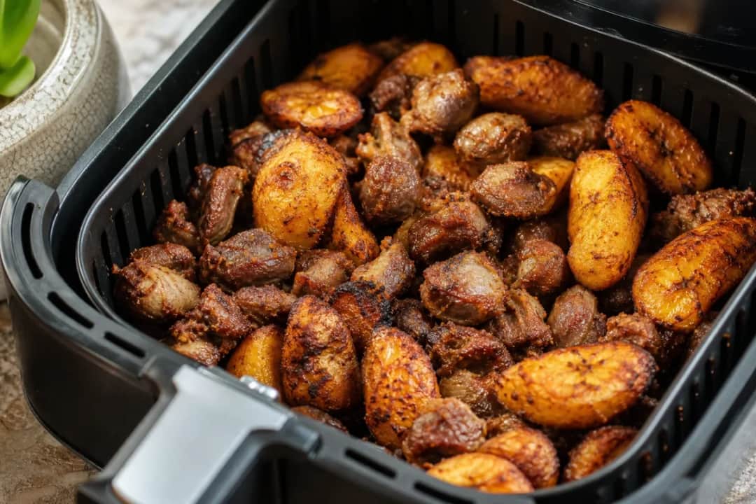Plated Air Fryer Spicy Gizdodo featuring crispy gizzards and golden plantains