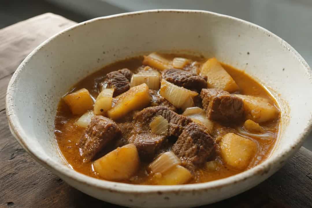 Creamy Massaman curry with beef, potatoes, and aromatic spices served in a bowl.