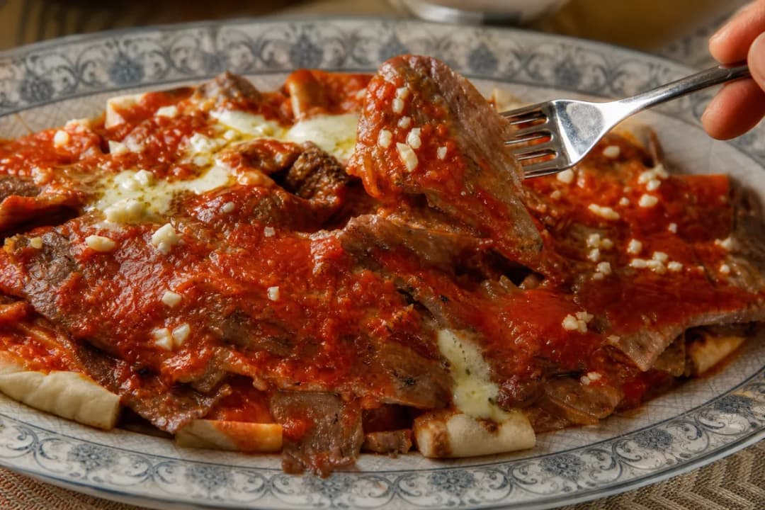 Authentic Turkish Iskender Kebab with Rich Tomato Sauce and Butter