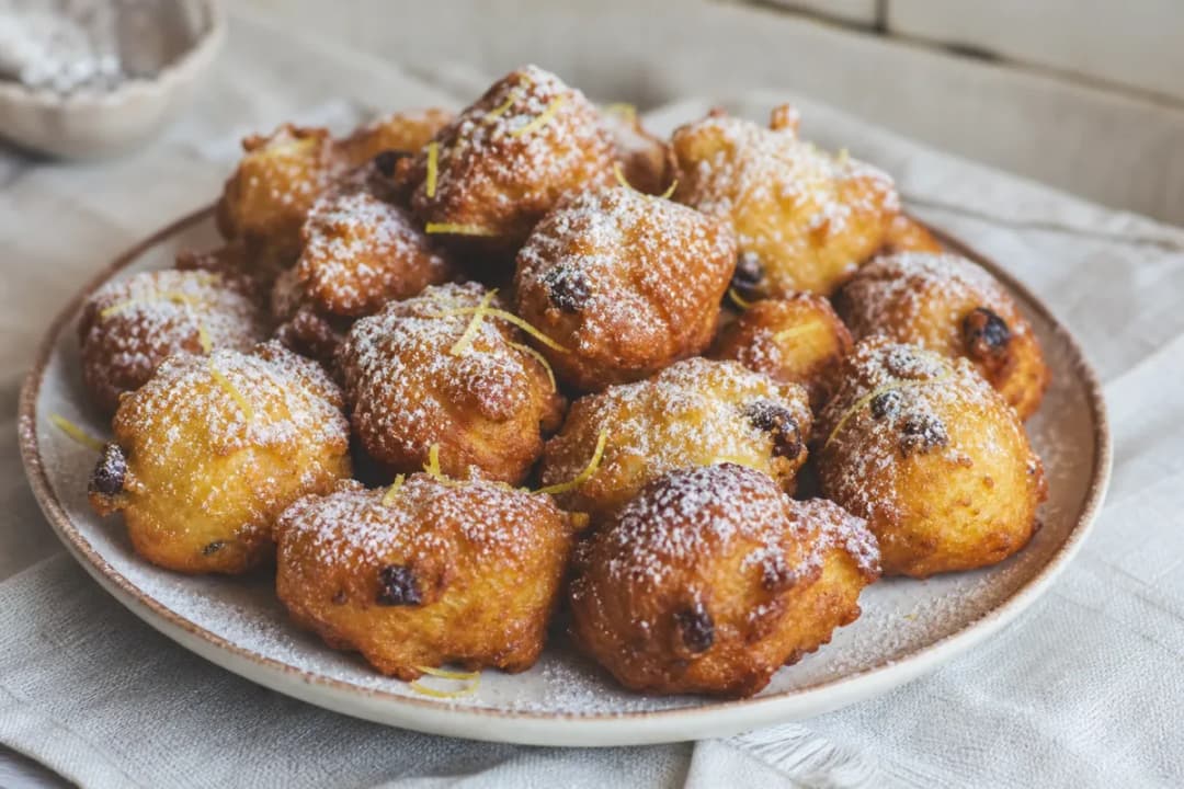 Croatian Fritule with Citrus, Raisins and Powdered Sugar