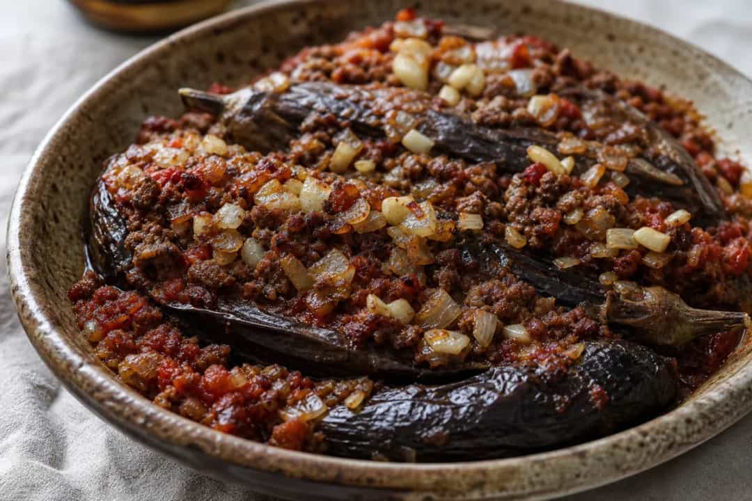 Layered eggplant and meat casserole with rich tomato sauce and spices.