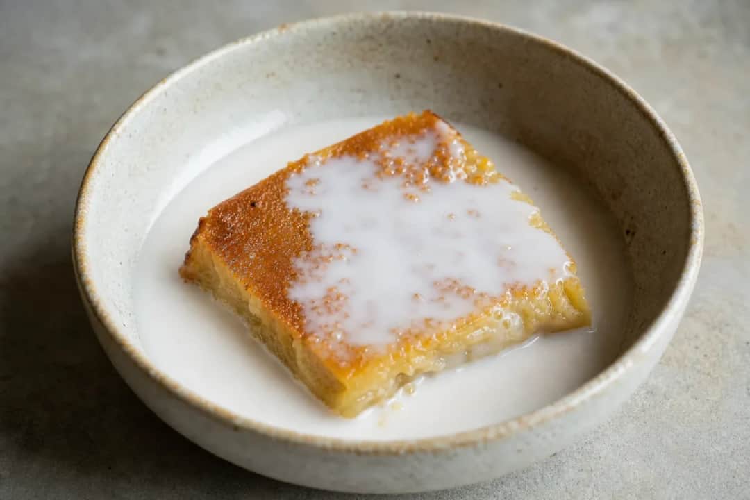 Creamy coconut custard layered with coconut cream, garnished and plated beautifully.
