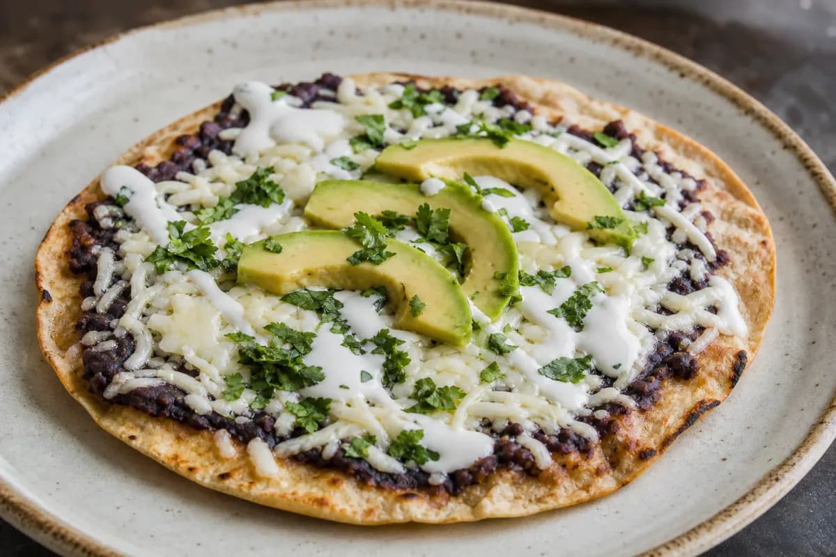 Mexican Tlayudas with Black Beans, Cheese and Avocado