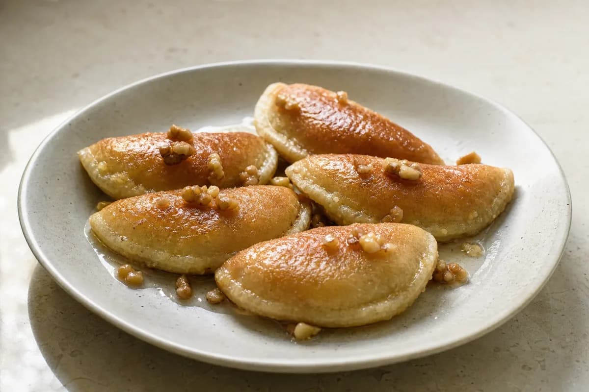 Palestinian Qatayef with Walnuts and Sweet Syrup